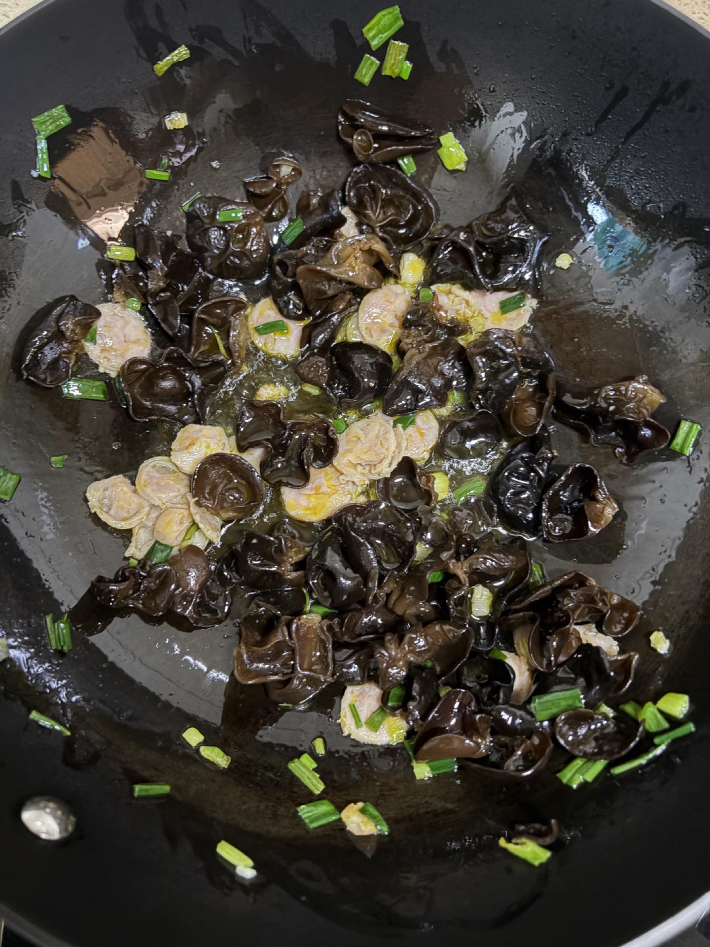 Add the sliced meat and stir-fry for another dozen or so tosses.