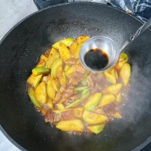 Finally, splash the Chinkiang vinegar down the side of the wok.