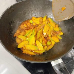 Slide it out of the wok and onto a serving plate.