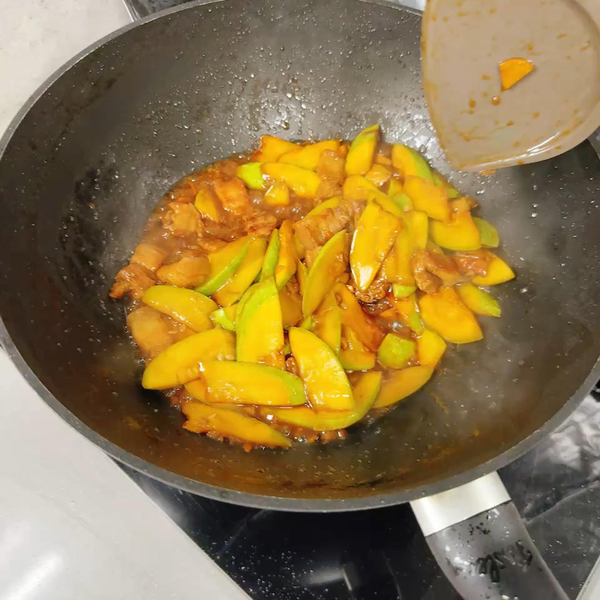 Slide it out of the wok and onto a serving plate.