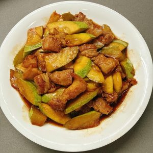 This is how zucchini should be stir-fried: crisp and tender without releasing water, with pork slices that are silky and never stringy. Spoon it with the sauce over rice and three