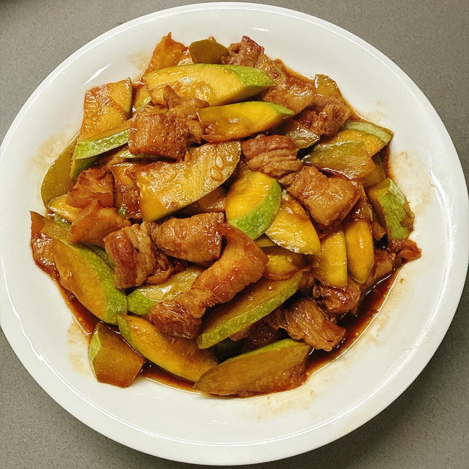 This is how zucchini should be stir-fried: crisp and tender without releasing water, with pork slices that are silky and never stringy. Spoon it with the sauce over rice and three