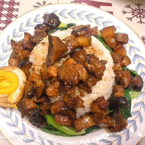 Taiwanese braised pork rice in a bowl with a tiger-skin egg