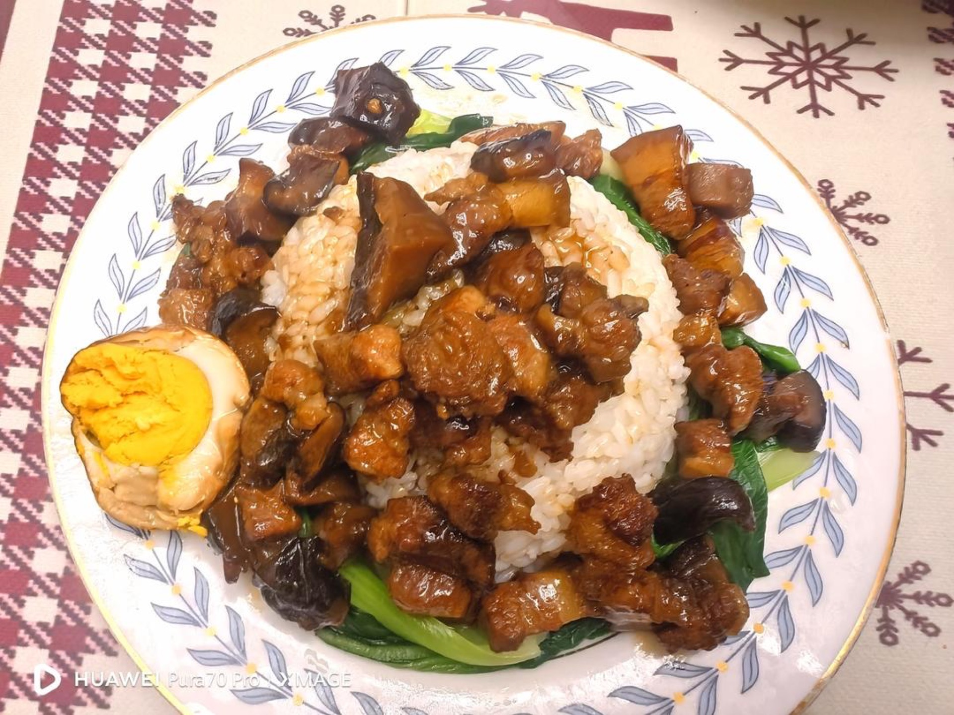 Taiwanese braised pork rice in a bowl with a tiger-skin egg