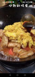 Add the fried eggs into the pan.