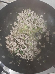 Add the minced garlic and scallion whites and stir-fry for about 30 seconds, until they smell sweet and fragrant.