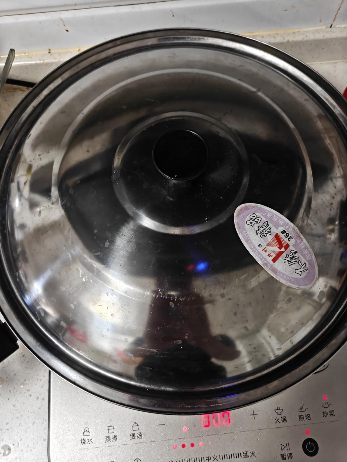Cover the wok and let the tomatoes steam and soften for 5 to 6 minutes, until they collapse into a loose sauce.