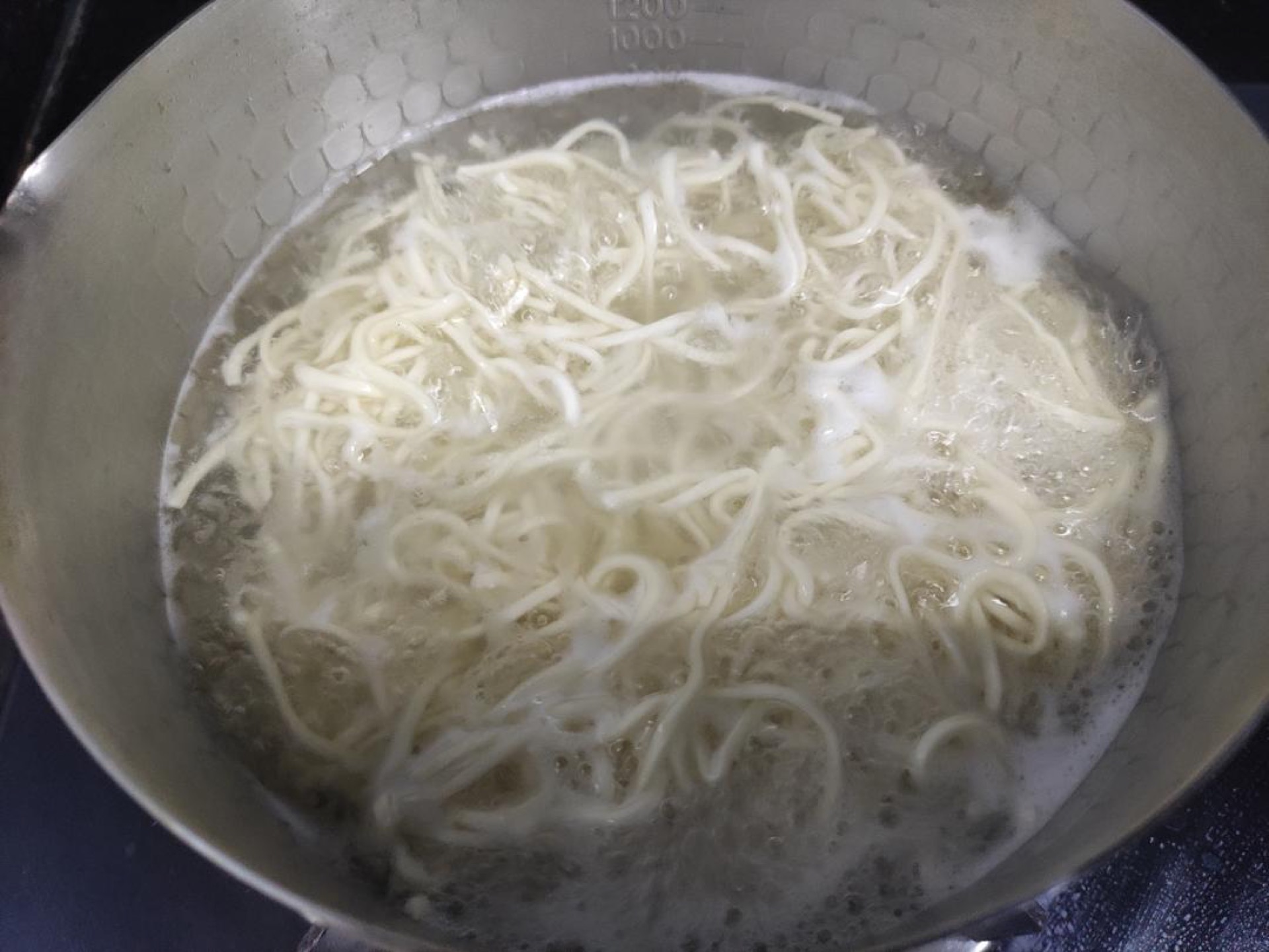 Boil the noodles until half-done first (they really must be half-done, or they will turn mushy after stir-frying), then rinse them under cold water.