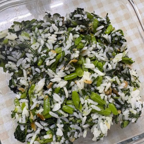 Vegetable mixed rice 蔬菜拌饭 in a bowl, glossy greens folded through hot white rice
