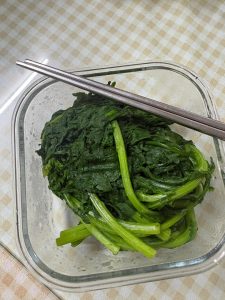 Lift the greens out with a slotted spoon and plunge them into cold water, or spread them on a tray to cool until you can handle them comfortably.