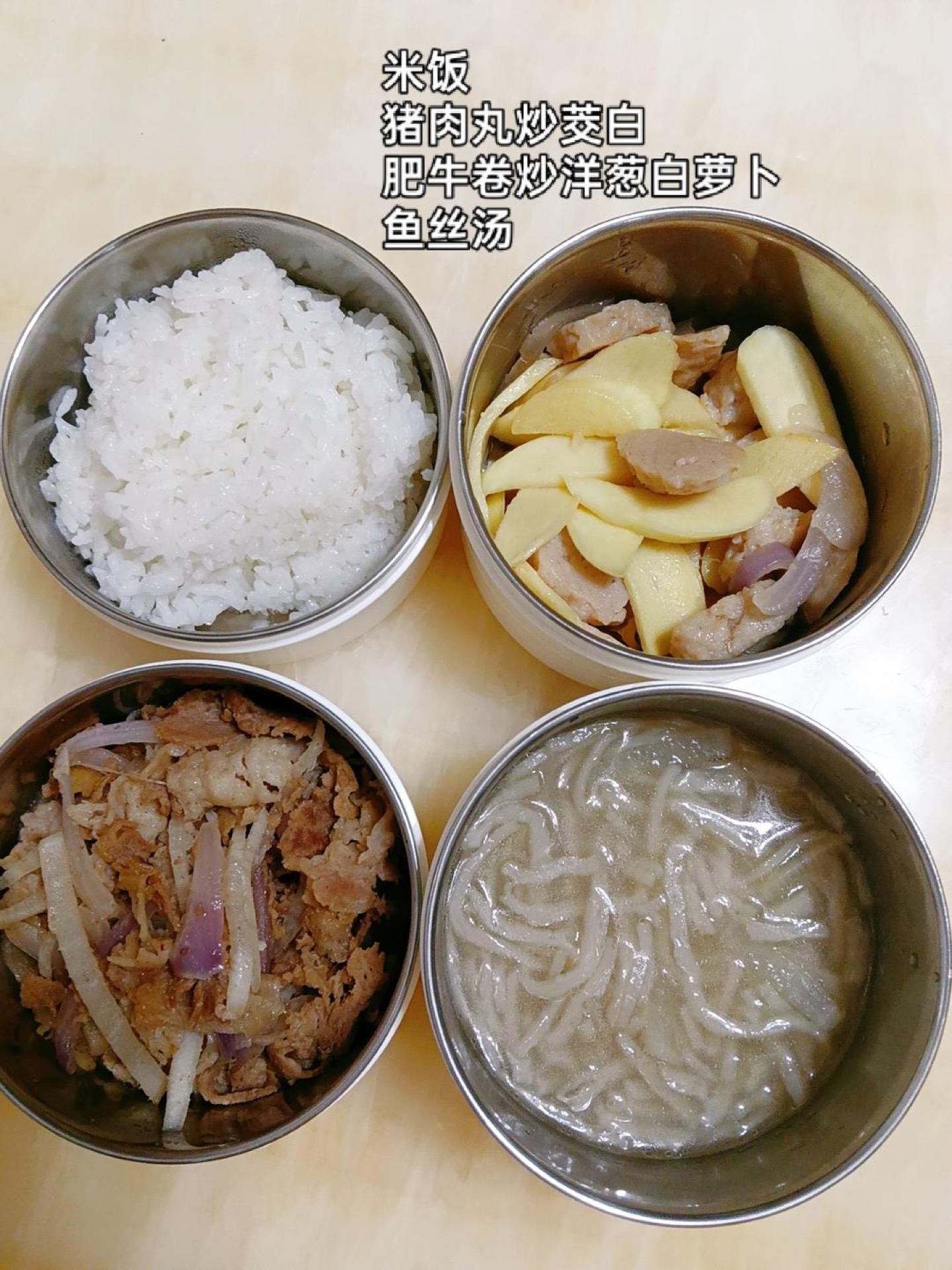 Pack steamed rice with stir-fried pork meatballs and water bamboo, stir-fried beef rolls with onion and white radish, and a shredded fish soup on the side.