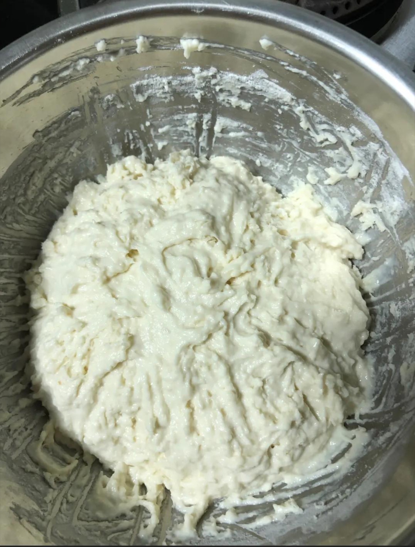 Keep kneading until the dough is smooth and elastic, then cover it and let it rest so the gluten relaxes and the dough rises.