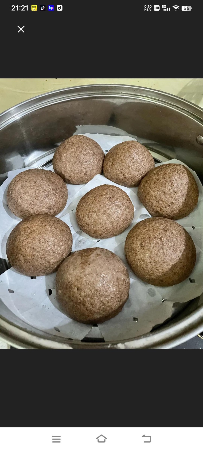 Divide and roll the risen dough into smooth round buns, set them on parchment in the steamer, and let them proof a second time until they feel light and spring back slowly.