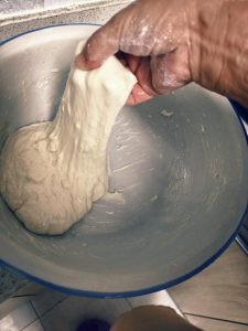 Dust the cutting board generously with flour and turn out the dough. Divide into 50 g portions and shape each into a wrapper, either by pressing or rolling with a rolling pin, keep