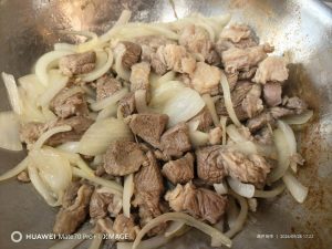 Add the onion and stir-fry until it softens and turns translucent.