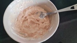In a small bowl, stir together 4 tablespoons of Greek yogurt, 1 tablespoon of peanut butter, and a pinch of sea salt until completely smooth.