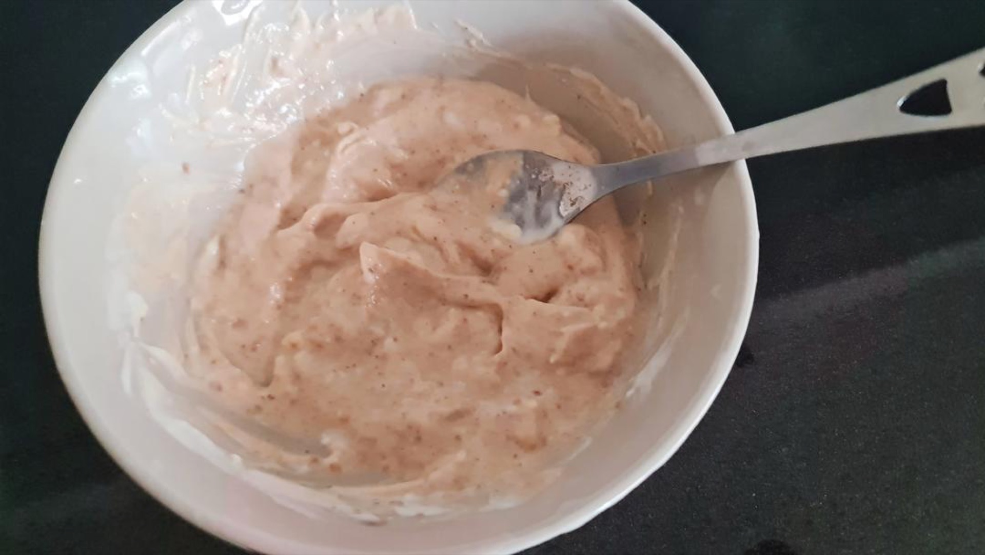 In a small bowl, stir together 4 tablespoons of Greek yogurt, 1 tablespoon of peanut butter, and a pinch of sea salt until completely smooth.