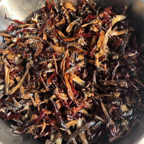 Jar of Yunnan oil-preserved mushrooms with chiles