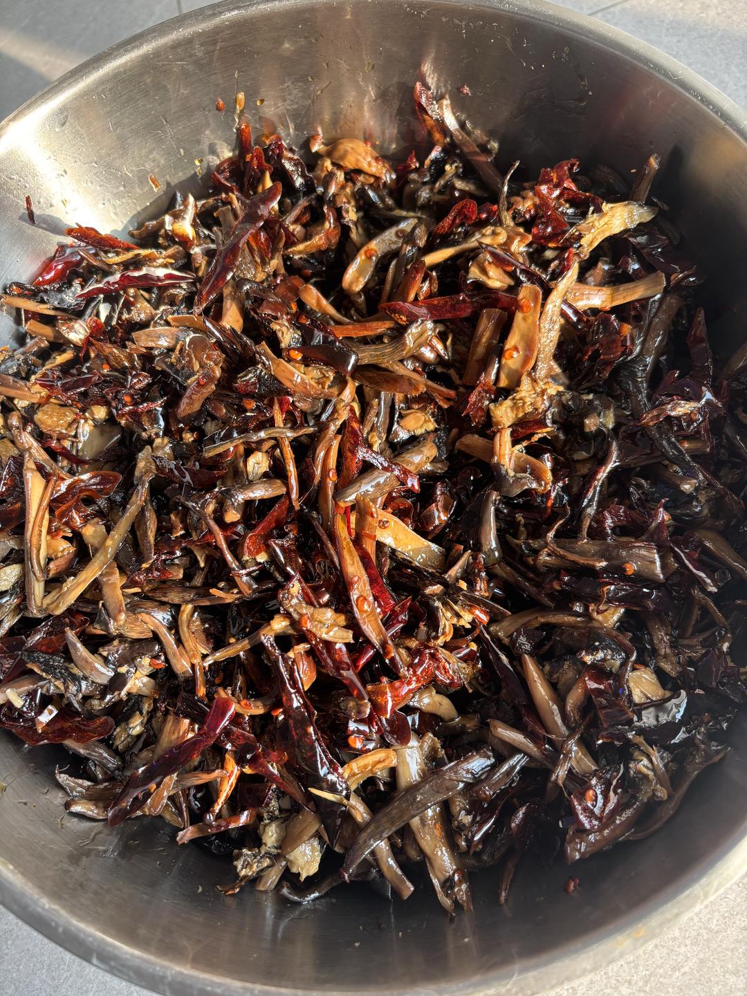 Jar of Yunnan oil-preserved mushrooms with chiles
