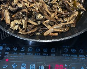 Mushrooms frying on an induction cooker