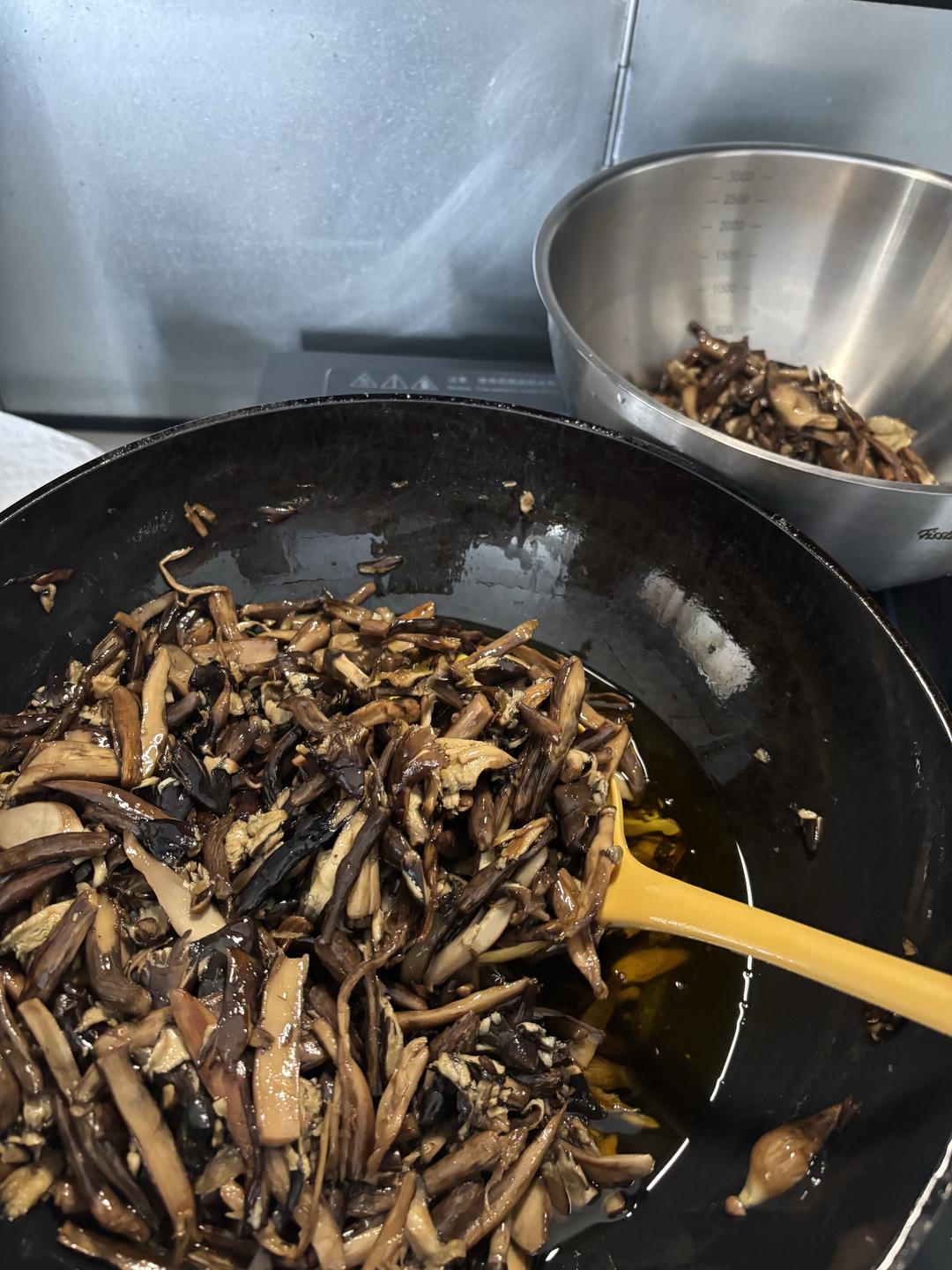 Fried mushrooms scooped out with their oil