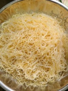 Spread the rice noodles evenly across a heatproof plate, and while you do this, set the steamer over the heat and bring the water to a boil.