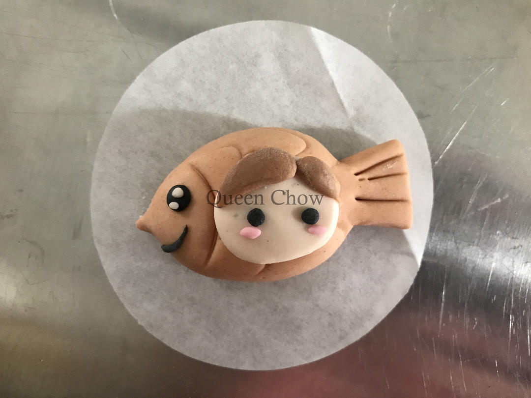 Use a scraper to fold the ears as shown