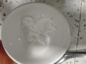 Stir the cornstarch with a small amount of water until smooth, then set the slurry aside.