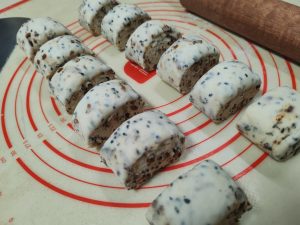 Cut the log into equal-sized pieces; this batch makes 12 buns.