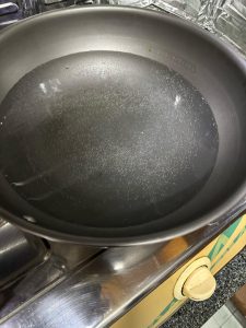 Bring a large pot with plenty of water to about 70–80°C (158–176°F) — the bottom of the pot should be covered with a dense cluster of tiny bubbles and the water should be making a