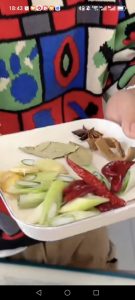 Prepare the aromatics: scallion, ginger, cinnamon bark, star anise, bay leaves, and dried chilis as shown.