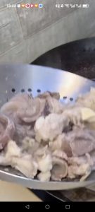 Scoop out the blanched beef tendon and rinse it clean under warm water.
