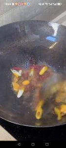 Add the prepared aromatics and stir-fry until fragrant.