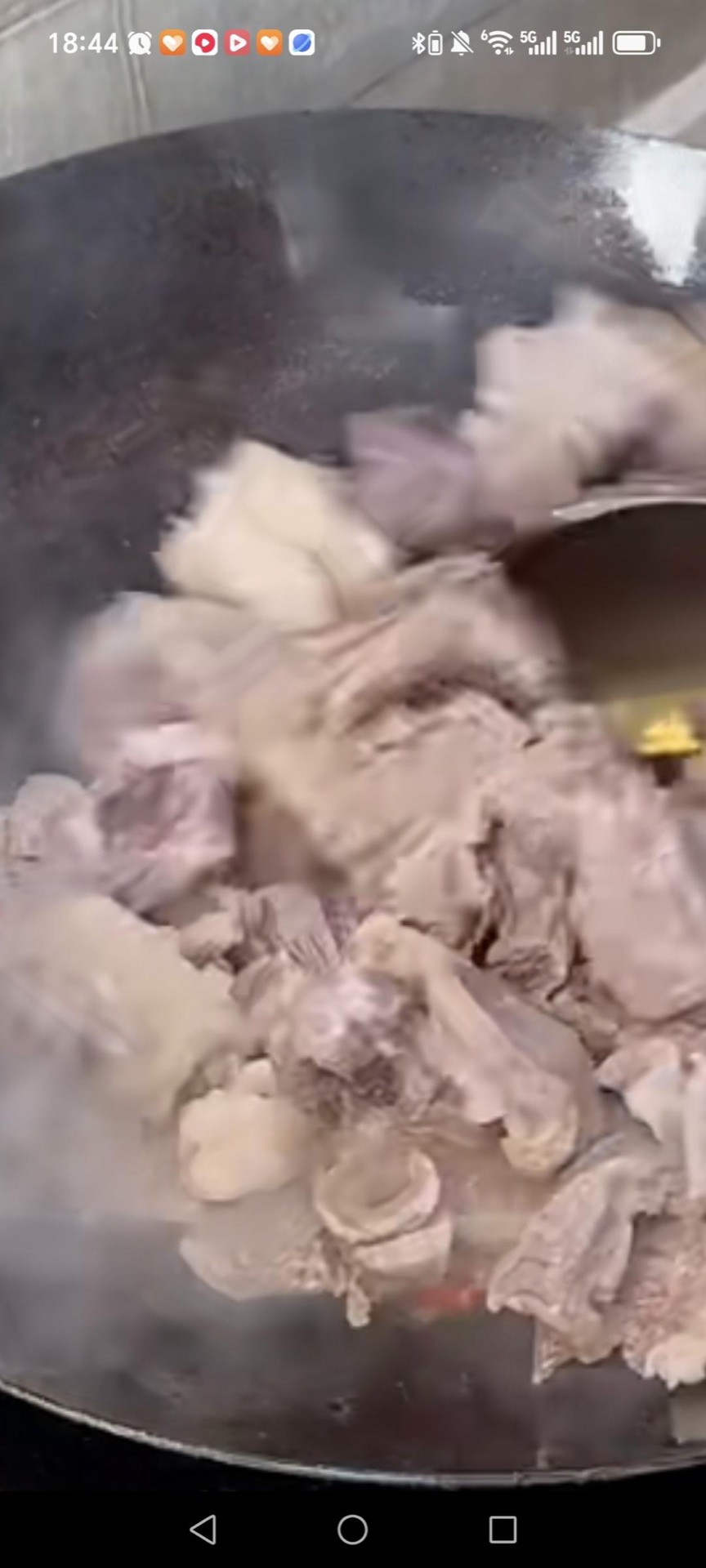Add the beef to the wok.