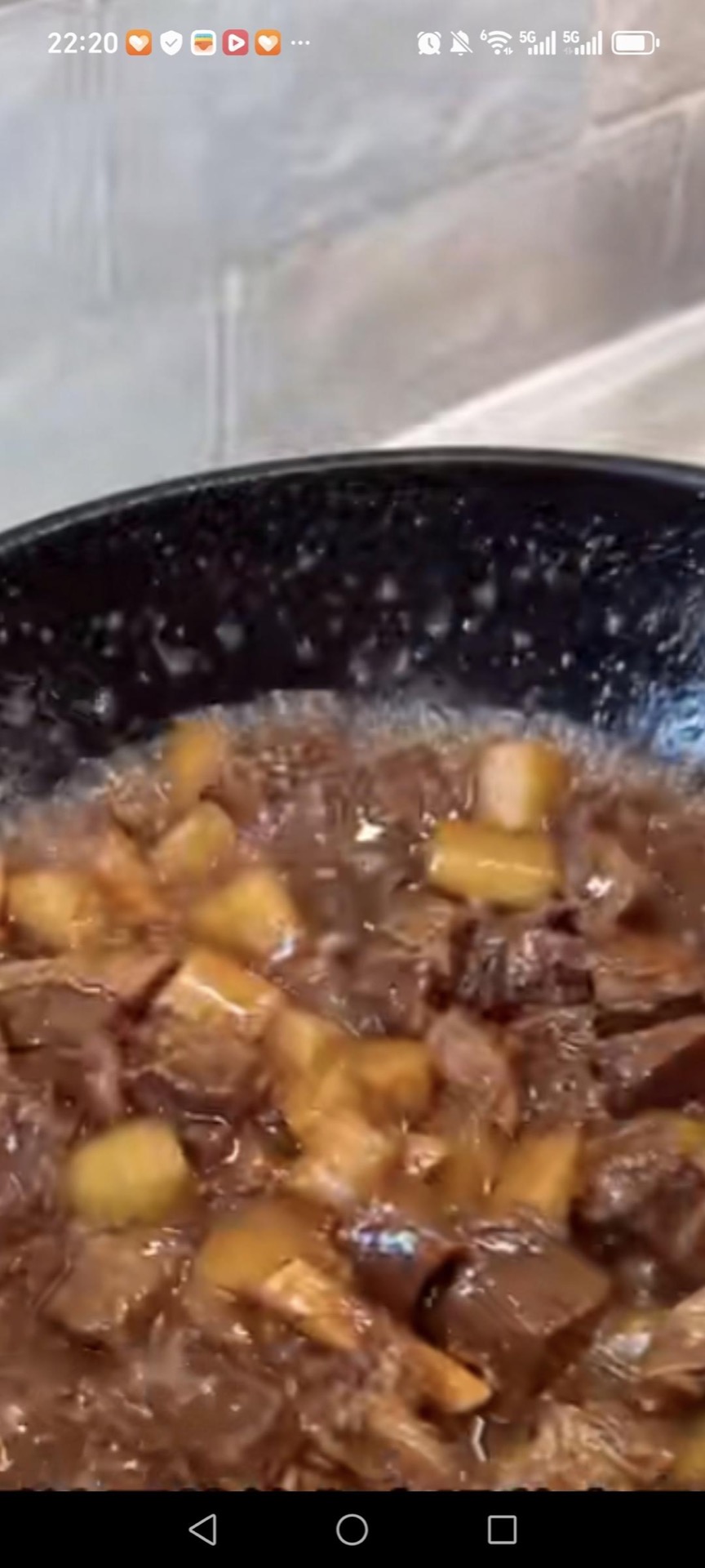 Uncover the wok, turn the heat to high, and reduce the braising liquid until it turns glossy and clings to the beef.