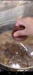 Cover the wok with a lid and simmer the beef gently for 1 hour, until the meat is starting to turn tender.