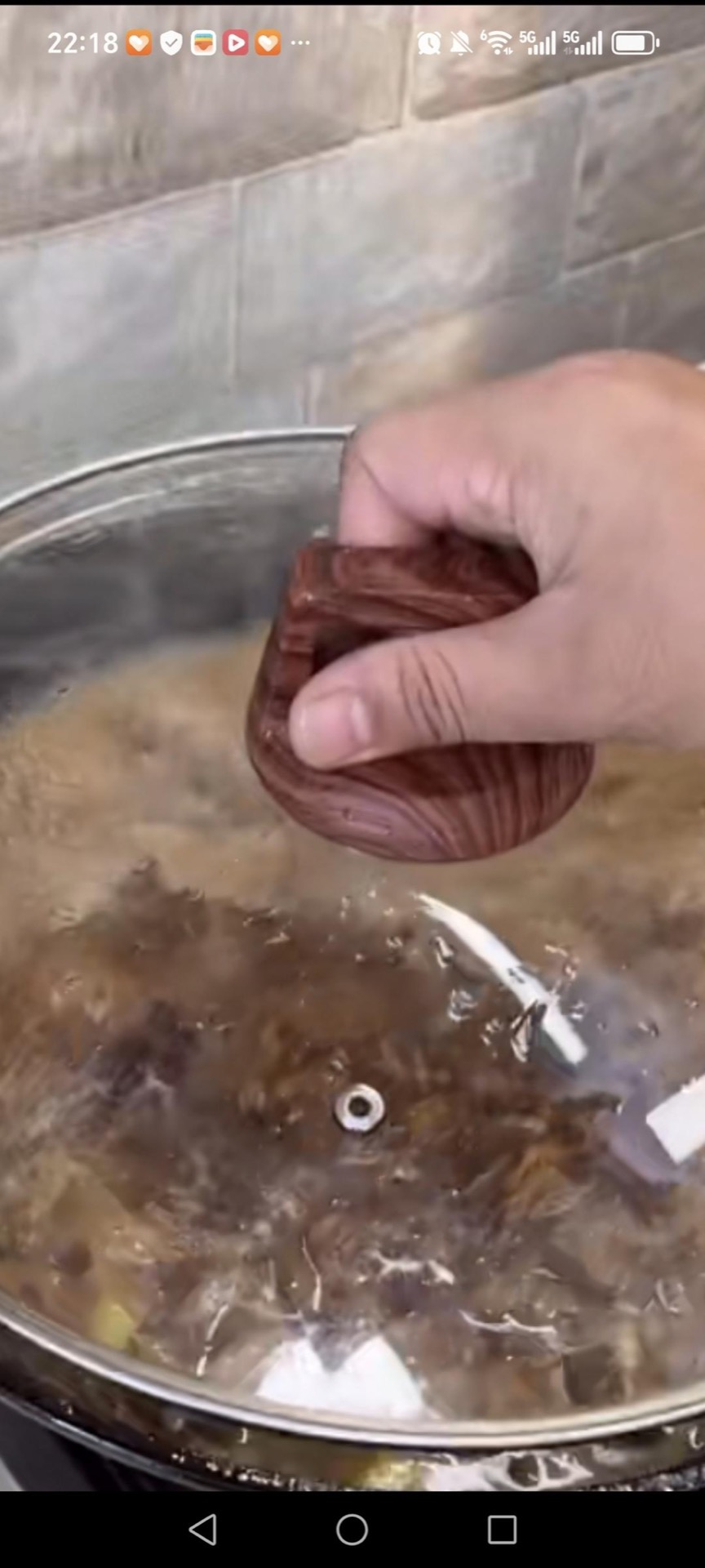 Cover the wok with a lid and simmer the beef gently for 1 hour, until the meat is starting to turn tender.