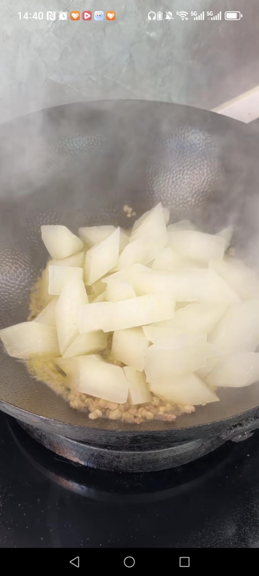 Add the radish chunks to the wok.