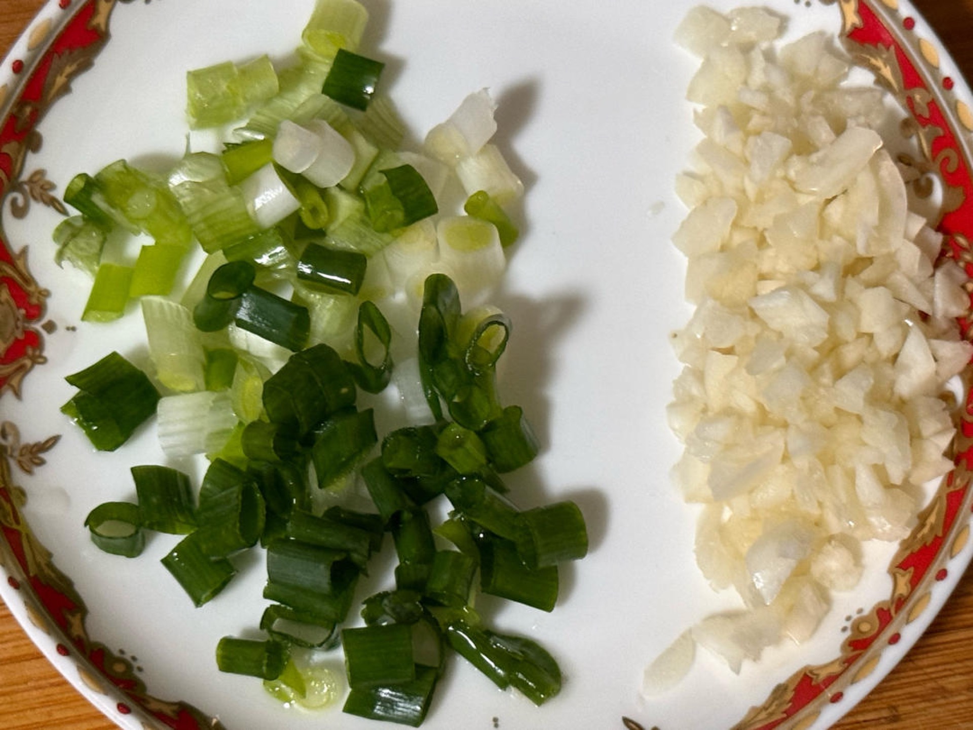 Finely chop the scallions, keeping the white parts and green parts separate, and mince the garlic.