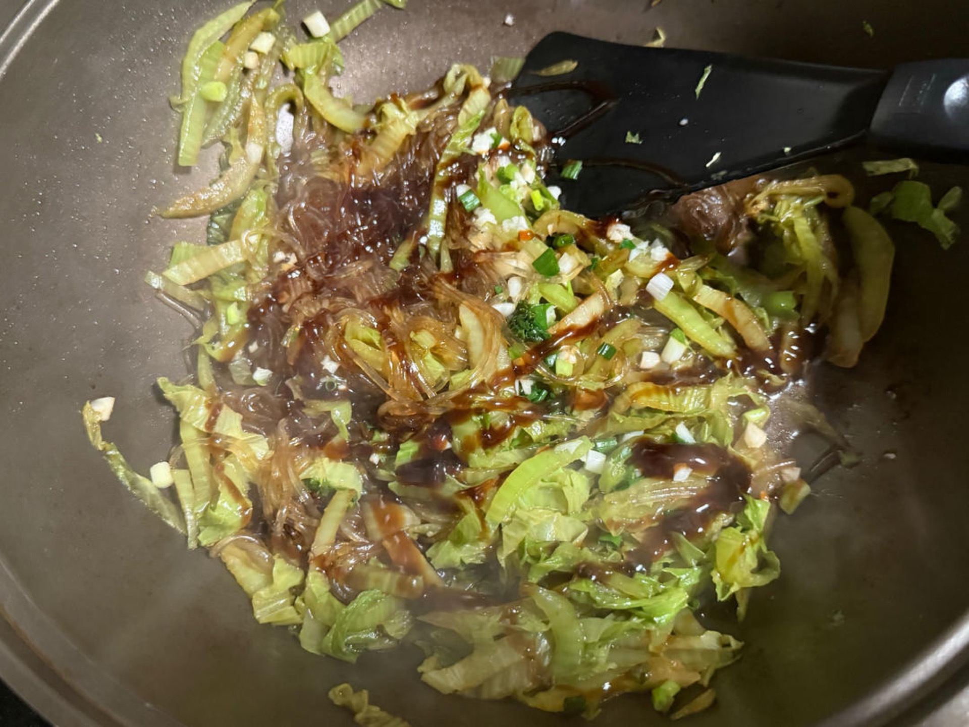 Drizzle in the oyster sauce, cover again, and braise a little longer until the vermicelli is soft and tender, then serve hot.