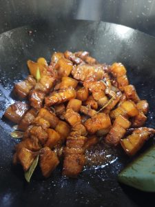 Give everything a good stir so the seasonings coat the pork evenly.
