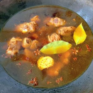 Pour in boiling water level with the ribs, cover, and simmer for about 40 minutes.