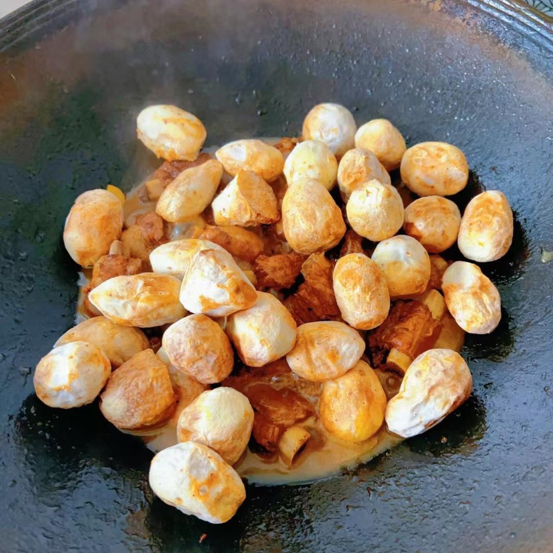 Add the roasted taro from step 2 to the wok, toss so every piece is coated in sauce, cover, and simmer for about 10 minutes more, stirring a few times so it heats evenly. Season wi