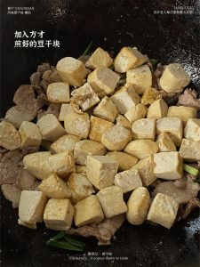 Then add back the golden tofu wedges you set aside earlier.