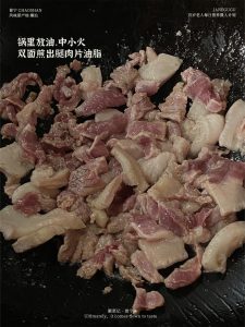 Add oil to the wok again and put the pork leg slices in to stir-fry until the fat renders out.
