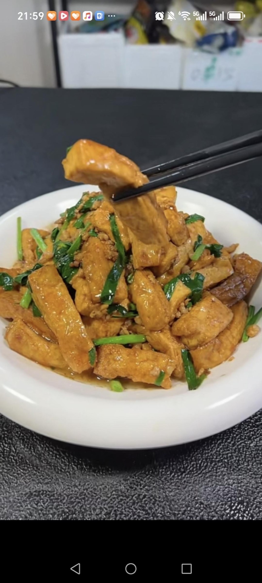 Slide the braised tofu with chives onto a serving plate and serve hot with steamed rice.