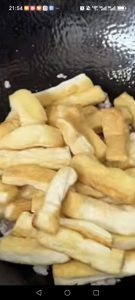 Add the pan-fried tofu back into the wok with the pork and spread everything into an even layer.