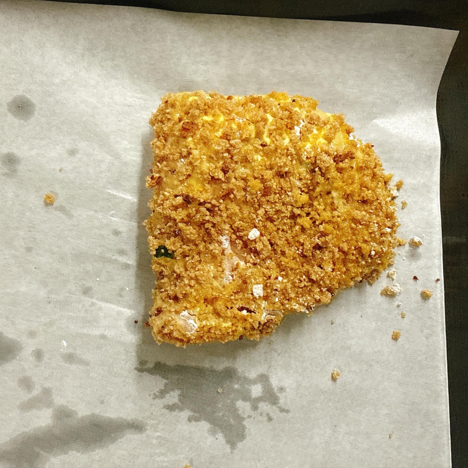 Place the prepared cutlets onto a baking sheet lined with parchment paper.