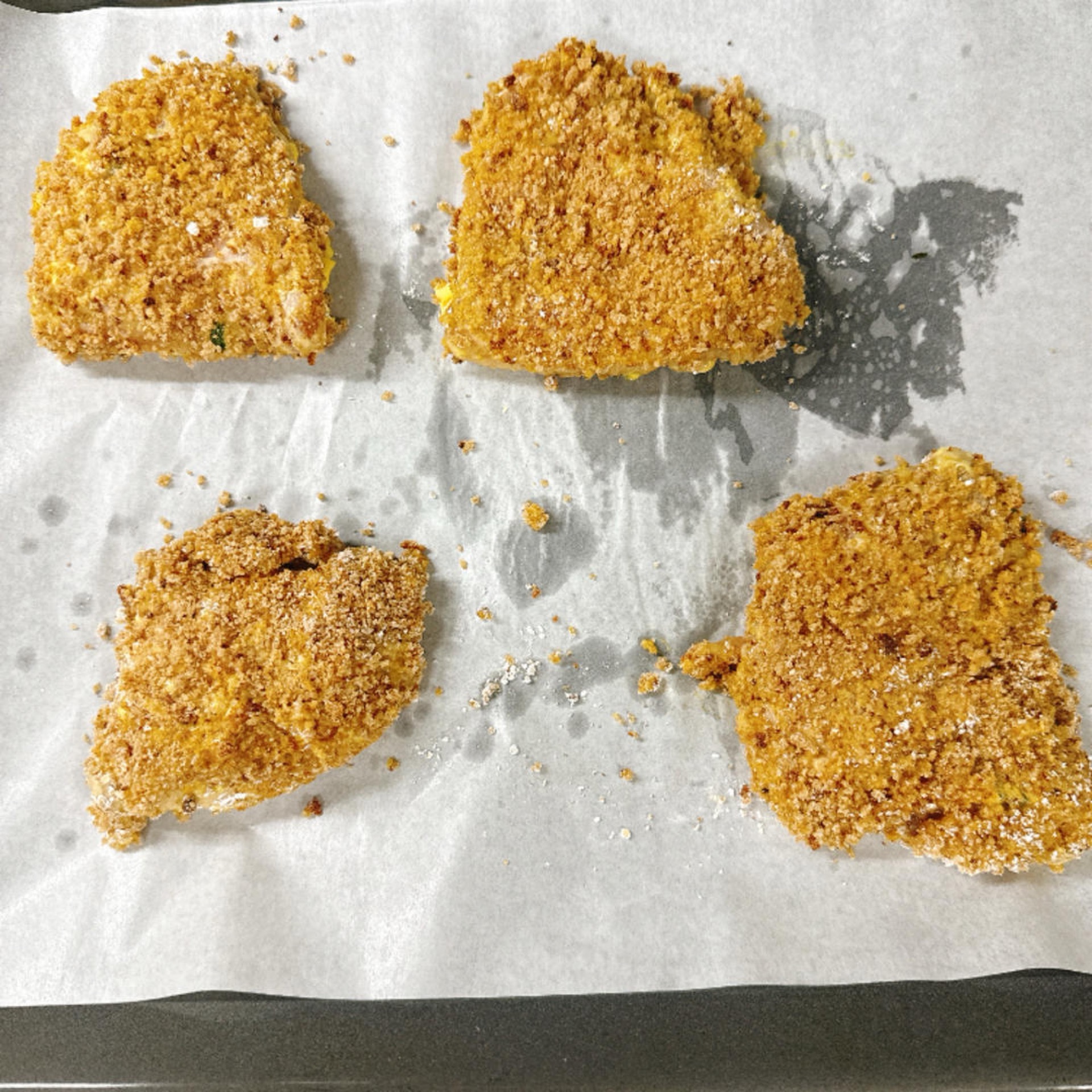 Repeat the breading process for all four cutlets.