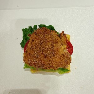 Set the crispy cheese-stuffed chicken cutlet on top.